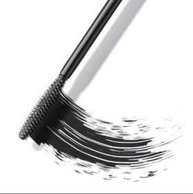 ICONIC LONDON mascara flatlay with makeup items showing travel-ready, vegan benefit
