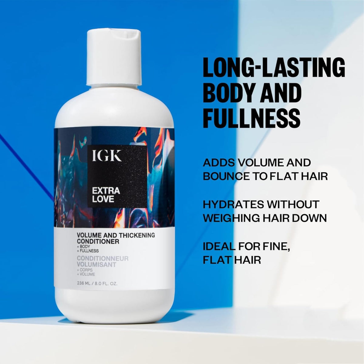 IGK Extra Love 8oz bottle next to everyday items showing true size benefit