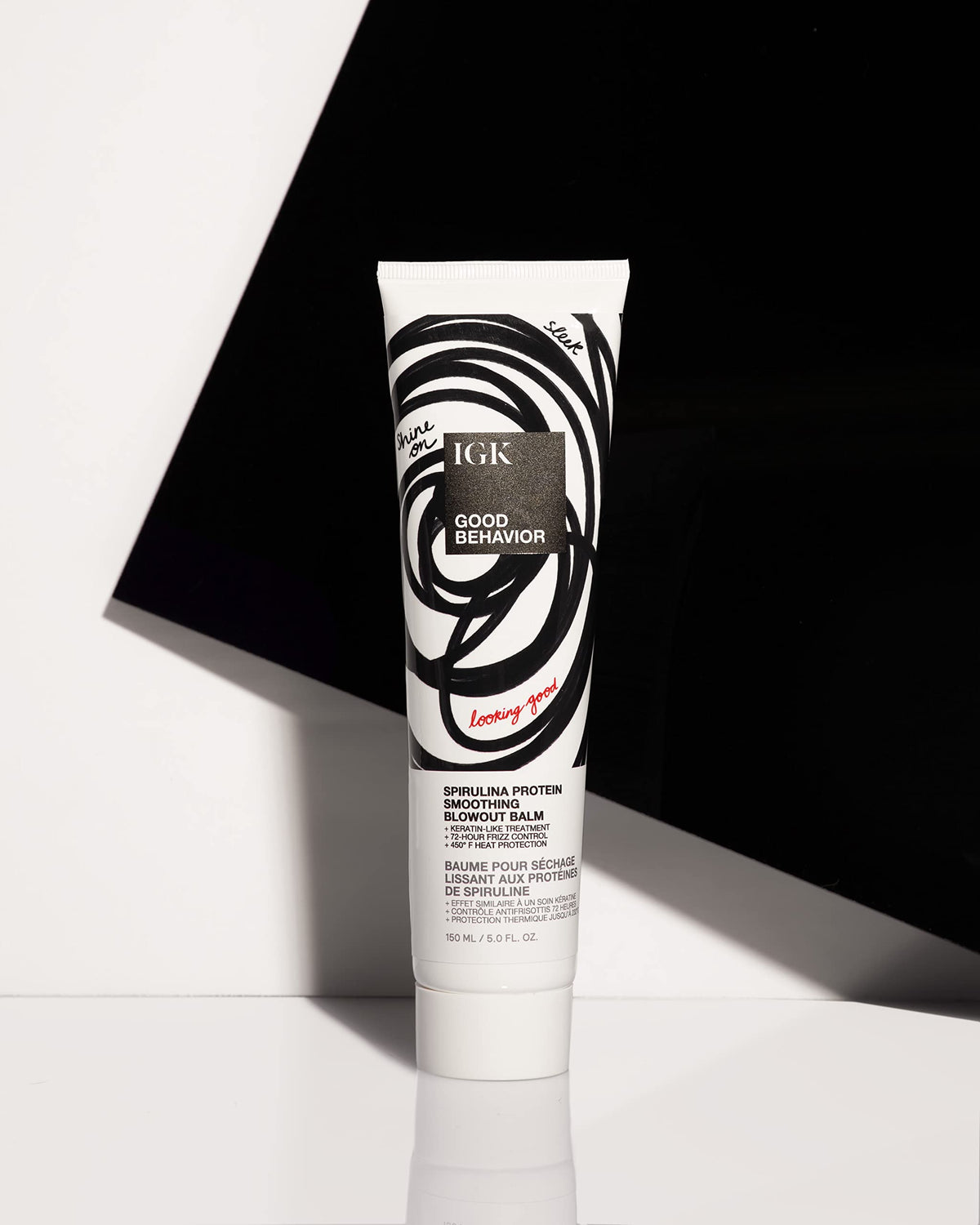 IGK in-use blow-dry styling scene showing controlled blowout and heat-activated smoothing benefit