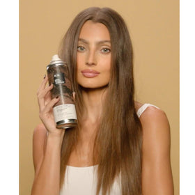 IGK bottle inside gym bag illustrating on-the-go refresh and odor elimination