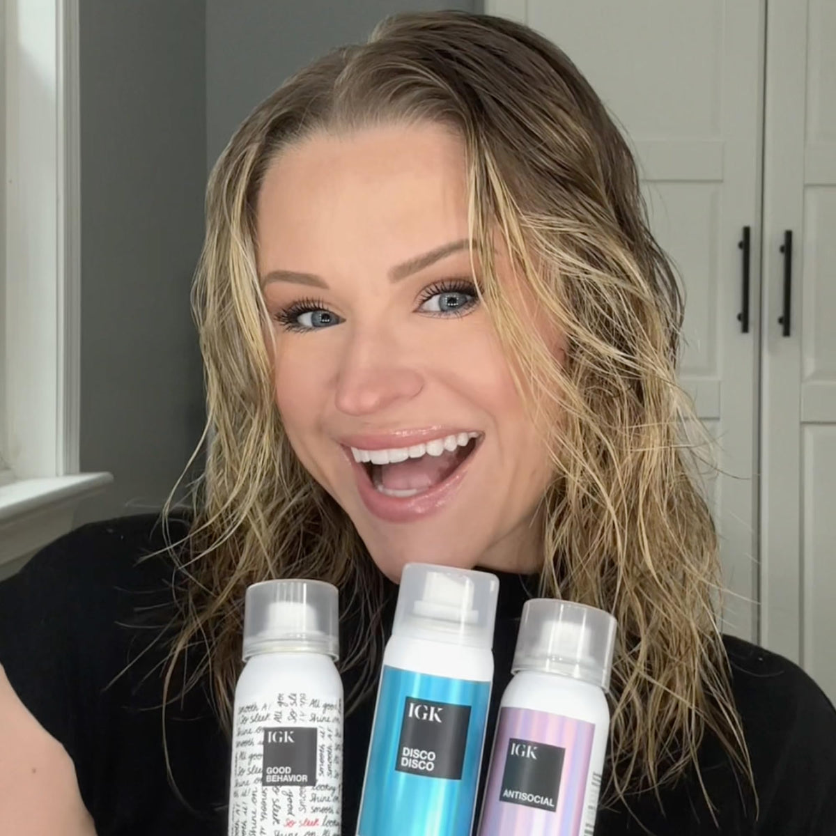 IGK products on holiday vanity with lights showcasing salon-quality results while traveling