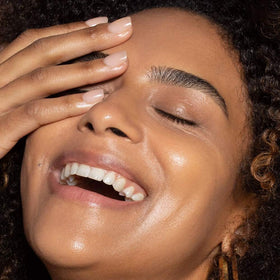 ILIA applying tint with fingers demonstrating blendability and quick coverage benefit