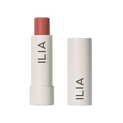 ILIA front packaging of Balmy Tint Hold Me shows warm peachy-nude shade and branding benefit