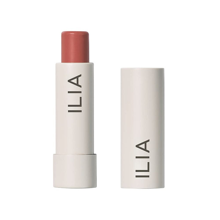 ILIA front packaging of Balmy Tint Hold Me shows warm peachy-nude shade and branding benefit
