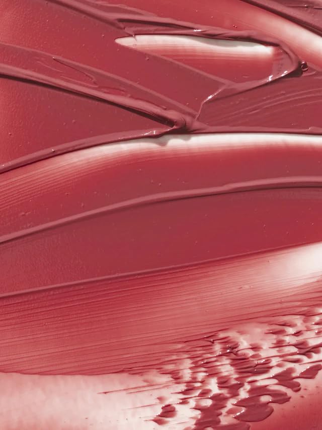 ILIA technician hand-pouring balm highlighting artisanal texture consistency benefit