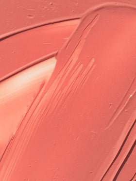 ILIA hand-poured label close-up showing craftsmanship and formula integrity benefit