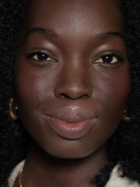 ILIA Balmy Tint tucked in a purse in a lifestyle scene for on-the-go hydration benefit