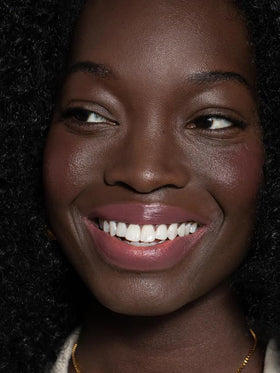 ILIA close-up on lips demonstrating smooth application and subtle cool-rose tint