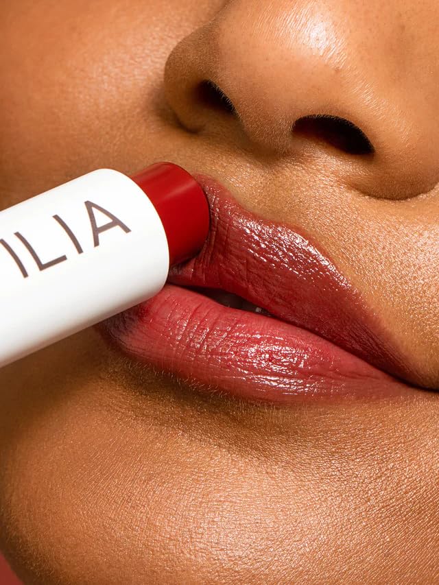 ILIA product in natural light emphasizing soft shine and dewy finish on lips