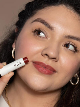 ILIA open tube angled to show balm shape and ready-to-use formula convenience