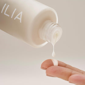 ILIA tucked in travel bag suggesting on-the-go hydration and convenience benefit