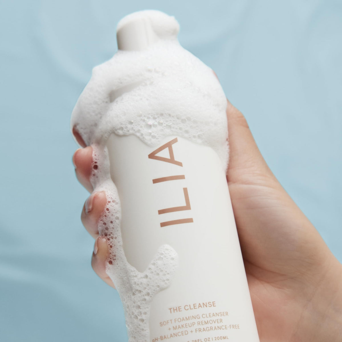 ILIA on bathroom shelf lifestyle shot evoking daily routine and clean design