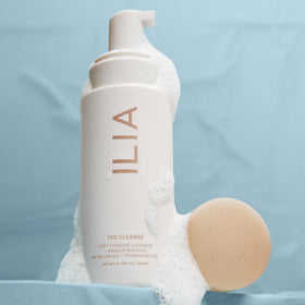 ILIA bottle with dispensed foam illustrating easy application and cleansing