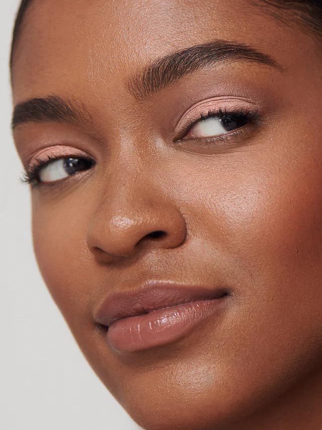 ILIA on model eyelid showing metallic rose-gold shimmer, wearable glam