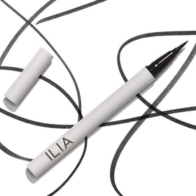 ILIA product in hand for scale showing compact travel-friendly benefit