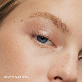 ILIA texture swipe of Beam on skin showing creamy shimmer and blendability