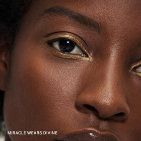 ILIA Eye Stylus Divine texture swipe demonstrating creamy shimmer payoff