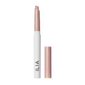 ILIA shadow stick front view showing slim tube and cool-pink shimmer finish