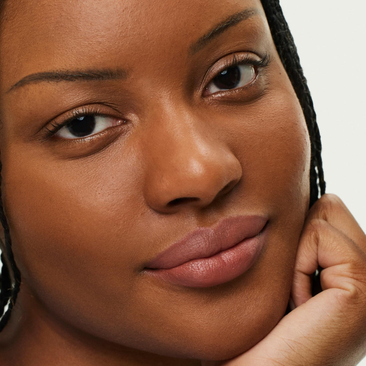 ILIA applied on lips in lifestyle shot showing defined, soft-matte finish
