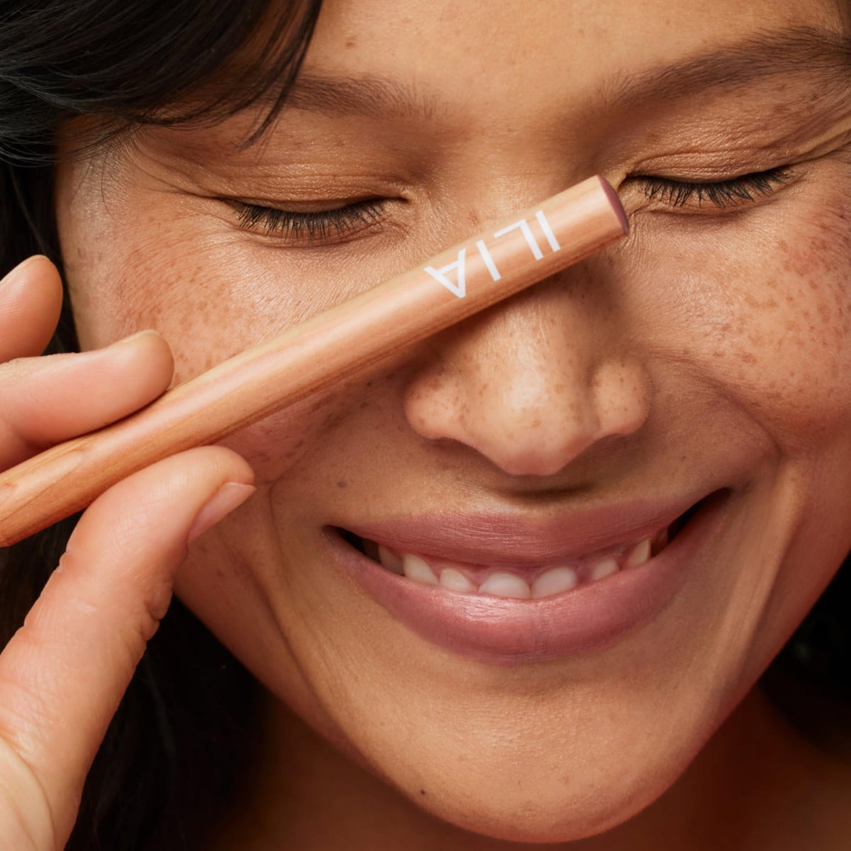 ILIA swatches on arm comparing buildable coverage and long-lasting pigment benefit