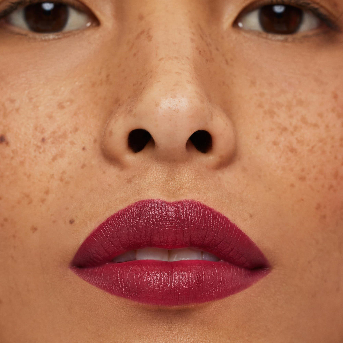 ILIA swatches on skin showing true deep magenta color payoff