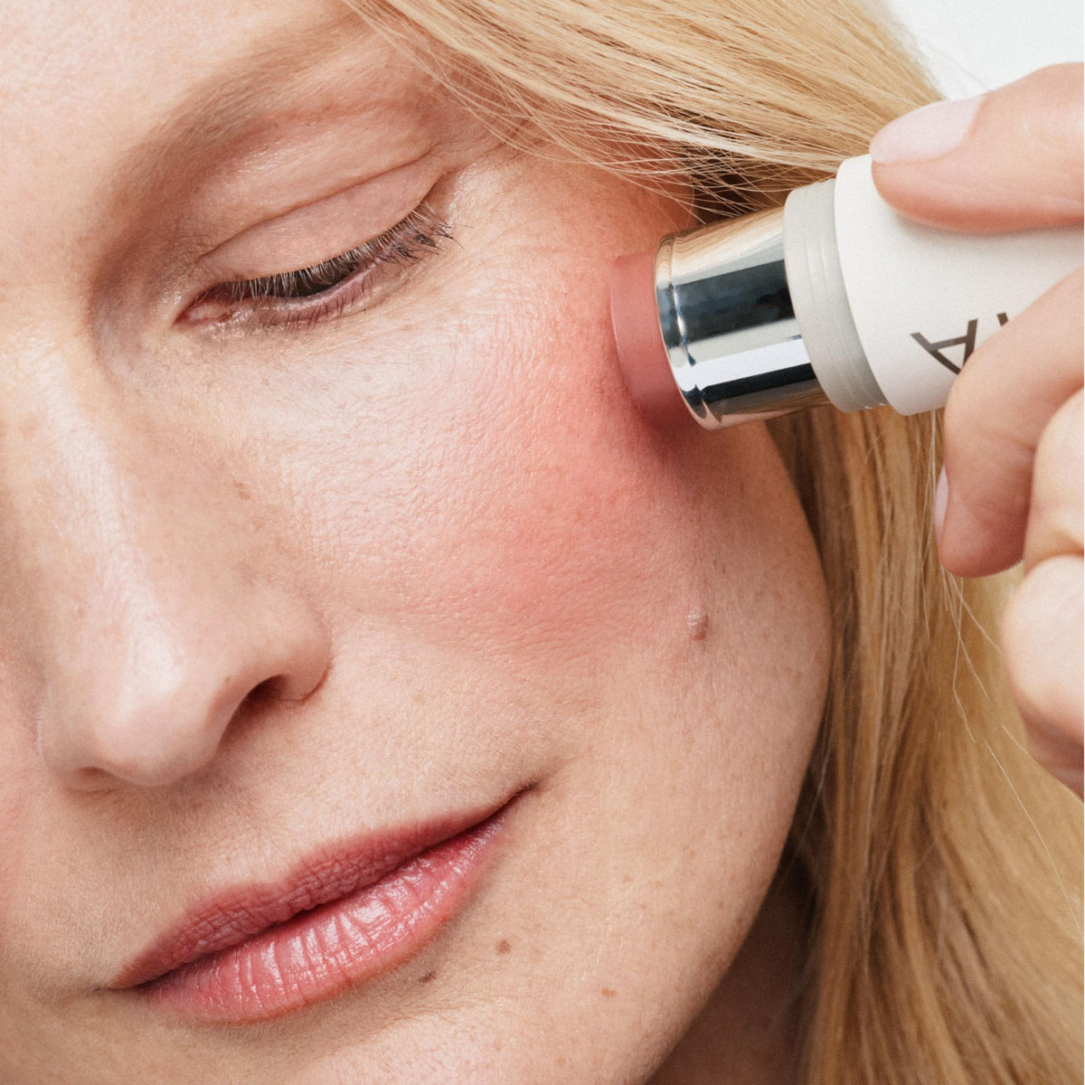 ILIA closeup of lips wearing Lady Bird, displays hydrating neutral rose tint
