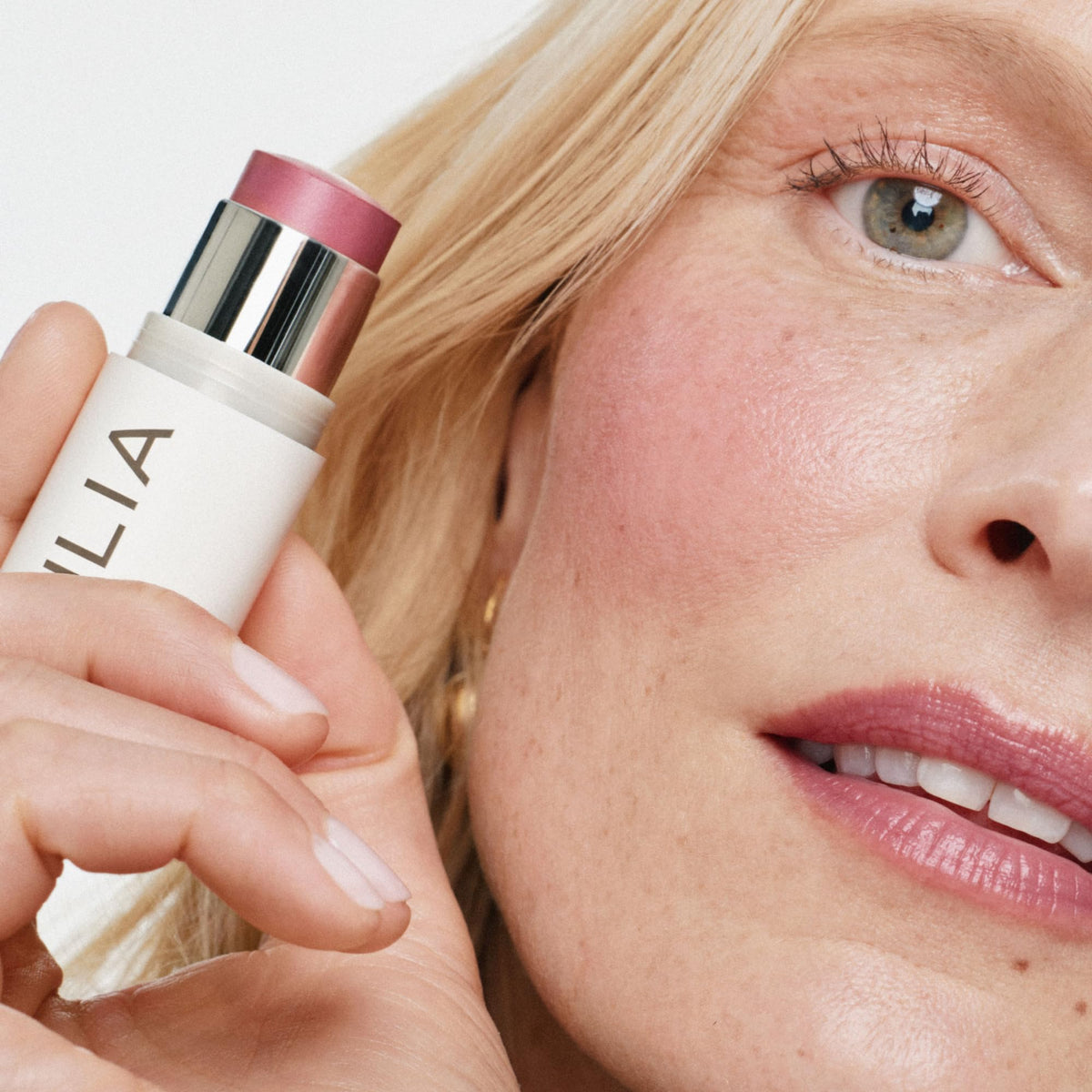 ILIA lip application of mauve rose delivering hydrated tint
