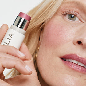 ILIA lip application of mauve rose delivering hydrated tint