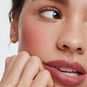 ILIA multi-stick applied on cheek demonstrating natural flushed benefit