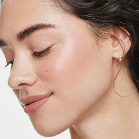 ILIA creamy texture swatch showing rose gold pearl radiance benefits