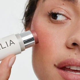 ILIA creamy swatch of Lady Bird on ivory surface, shows blendable texture and finish
