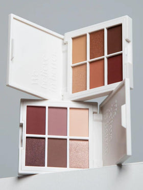 ILIA palette next to coin for scale to show travel-ready size and convenience