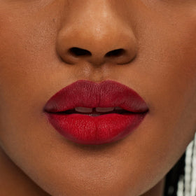ILIA applied on model showing lip definition and long-wear benefit