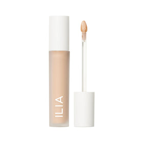 ILIA front packaging of Skin Blur Serum Concealer showing compact tube and cap, simple travel-ready benefit