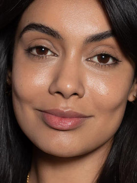 ILIA drop of skin tint on hand showing lightweight texture and hydration benefit