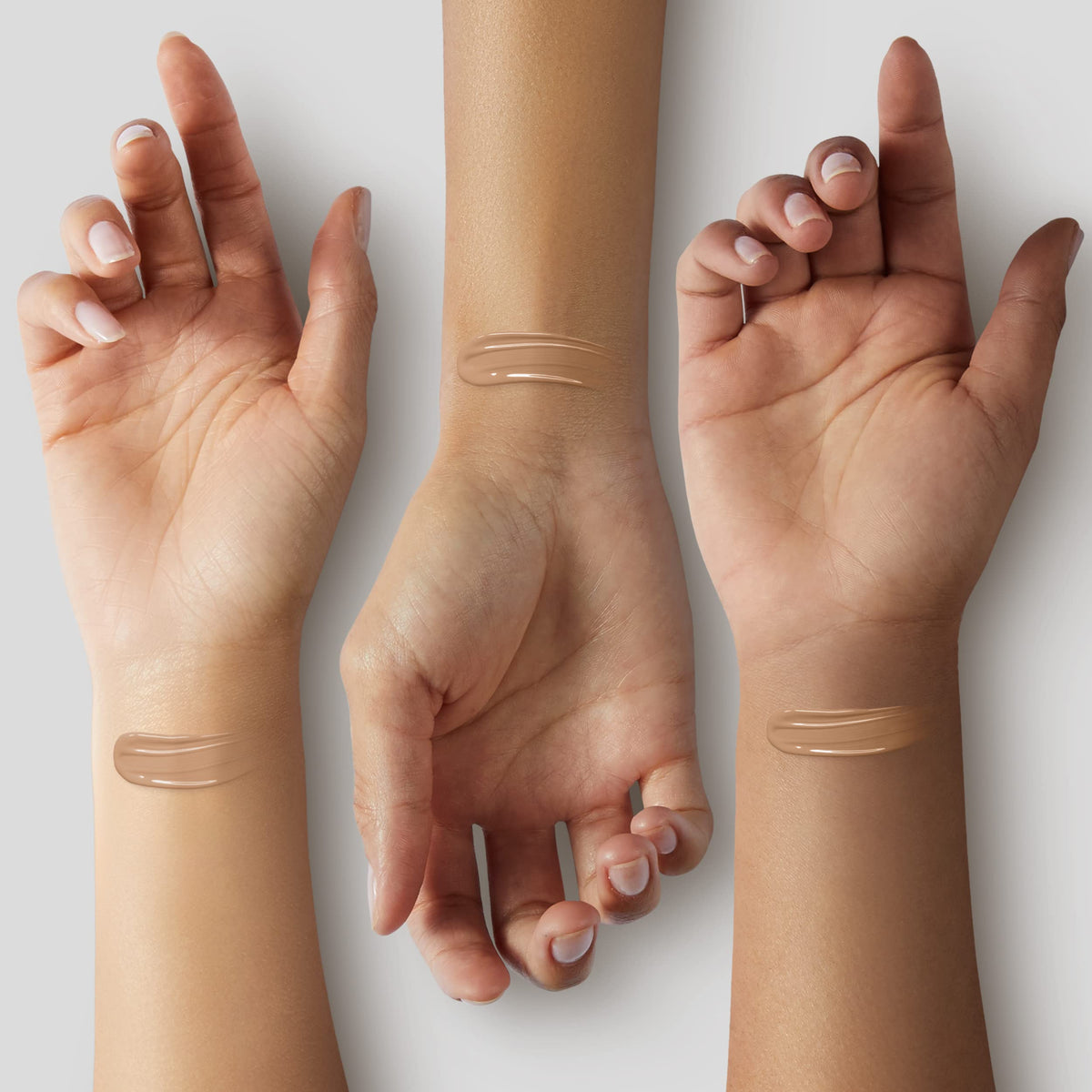 Swatch of ILIA Super Serum Skin Tint Paloma ST9 on arm showing true color and blendability
