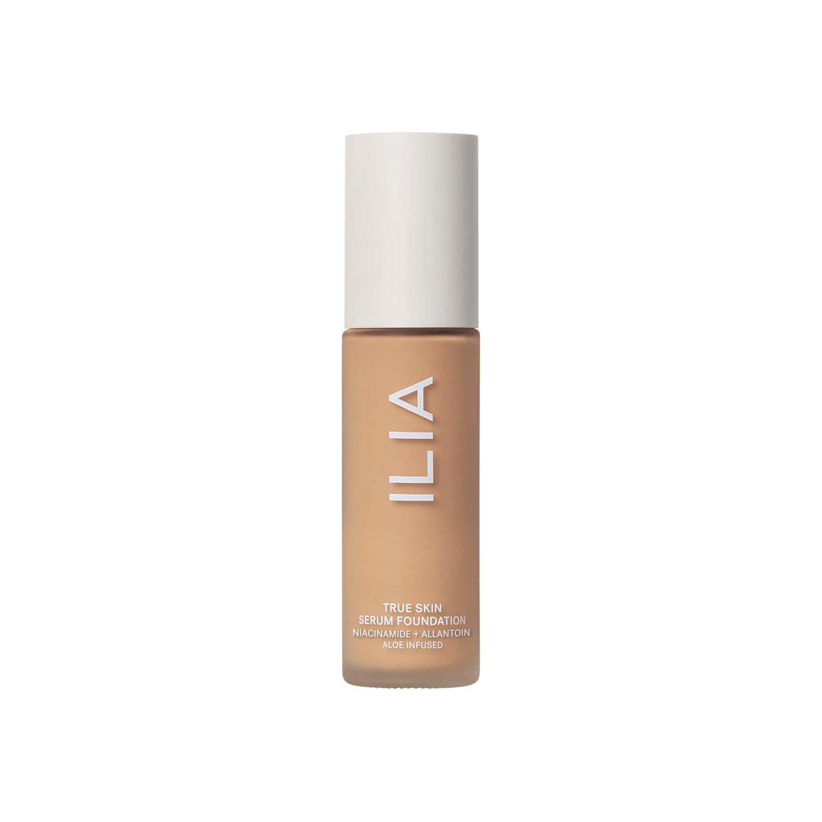 ILIA bottle beside ruler showing 1 fl oz size for scale and travel planning