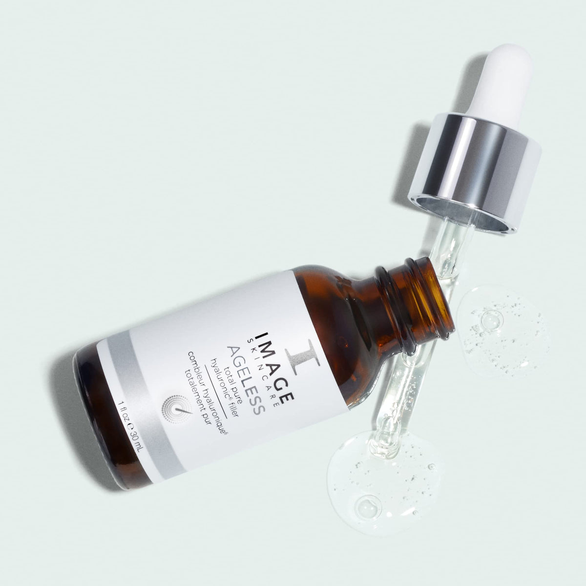 IMAGE Skincare serum on bathroom counter during nighttime routine showing layering benefit