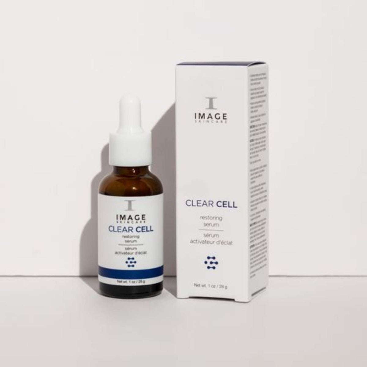IMAGE Skincare clear cell bottle next to moisturizer displaying layering compatibility in routine