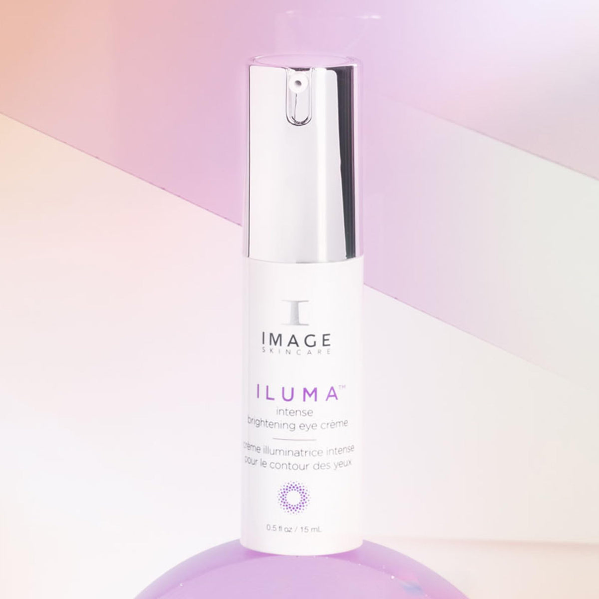 IMAGE Skincare ILUMA half-ounce tube next to common items to show size