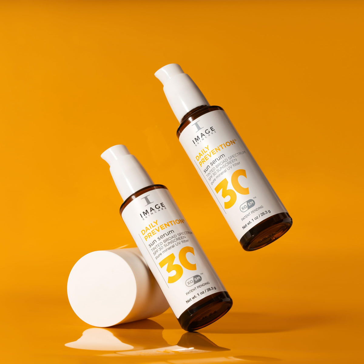 IMAGE Skincare ingredient flatlay with squalane and botanicals displaying nourishing actives