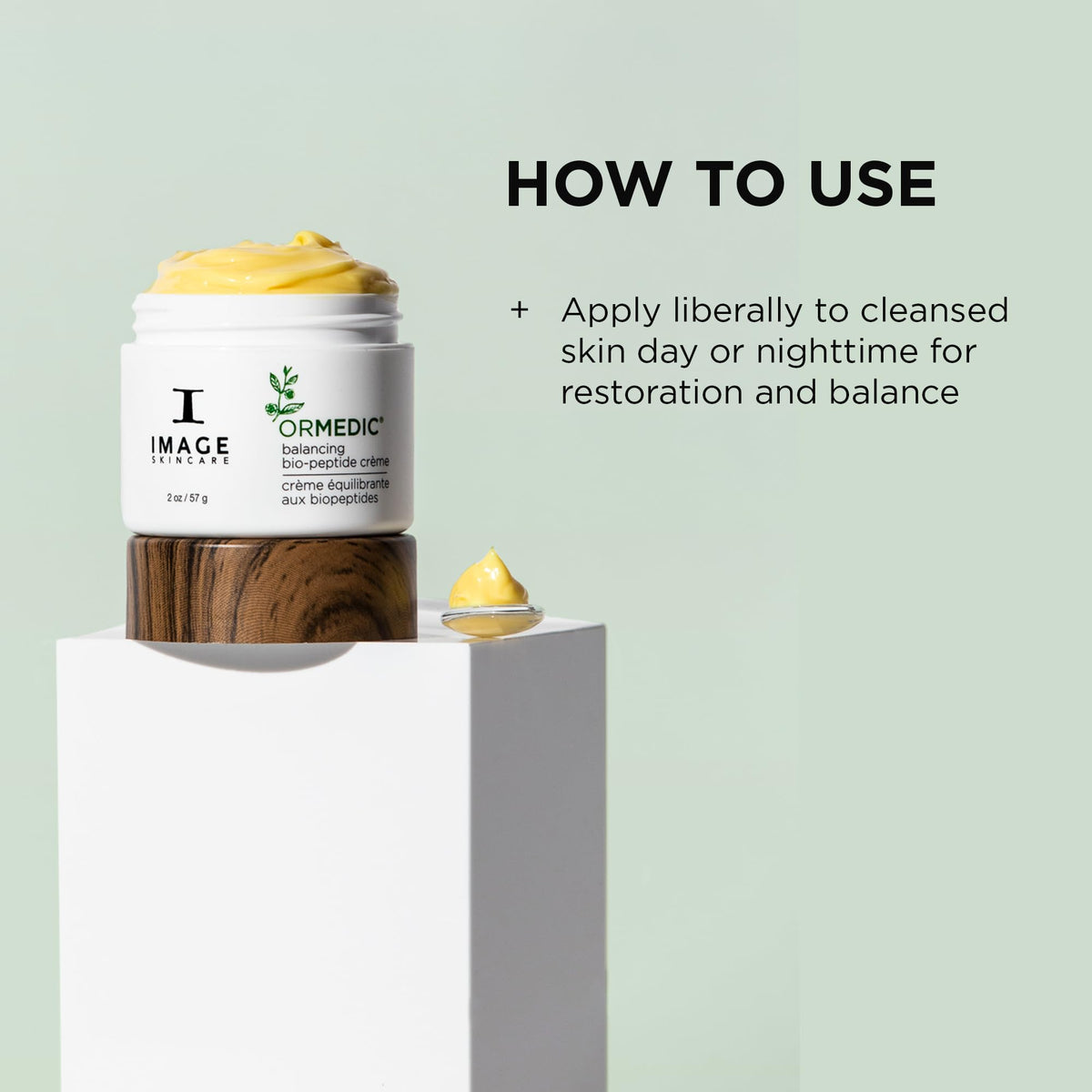 IMAGE Skincare ORMEDIC Biopeptide Crème next to ruler for 2oz size and travel convenience