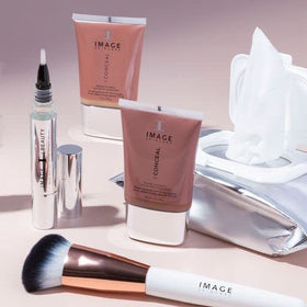 IMAGE Skincare pack next to a smartphone showing compact travel-friendly size