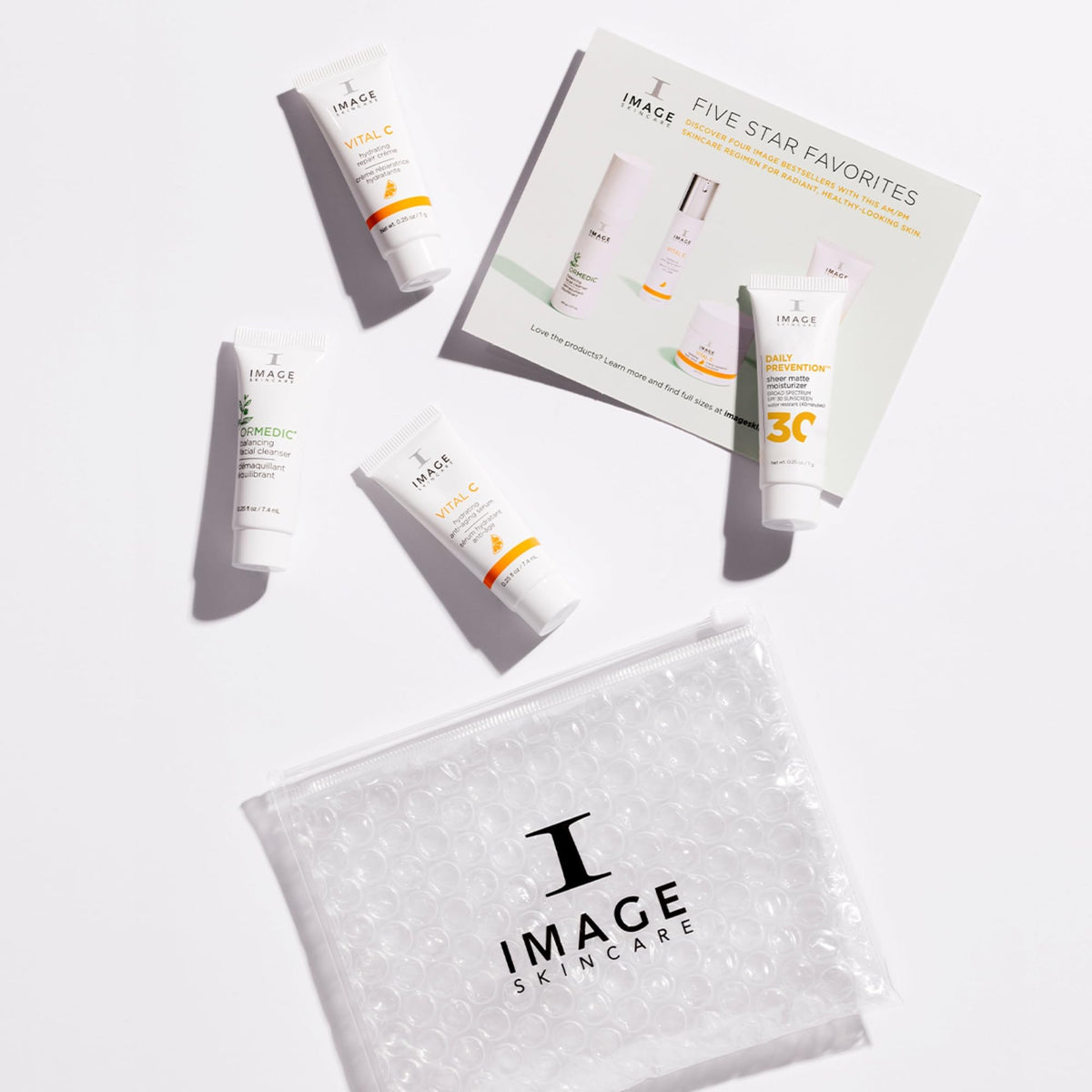 IMAGE Skincare travel kit on bathroom counter conveying convenient trial use