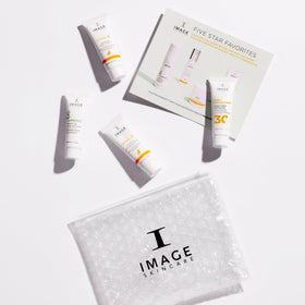 IMAGE Skincare travel kit on bathroom counter conveying convenient trial use