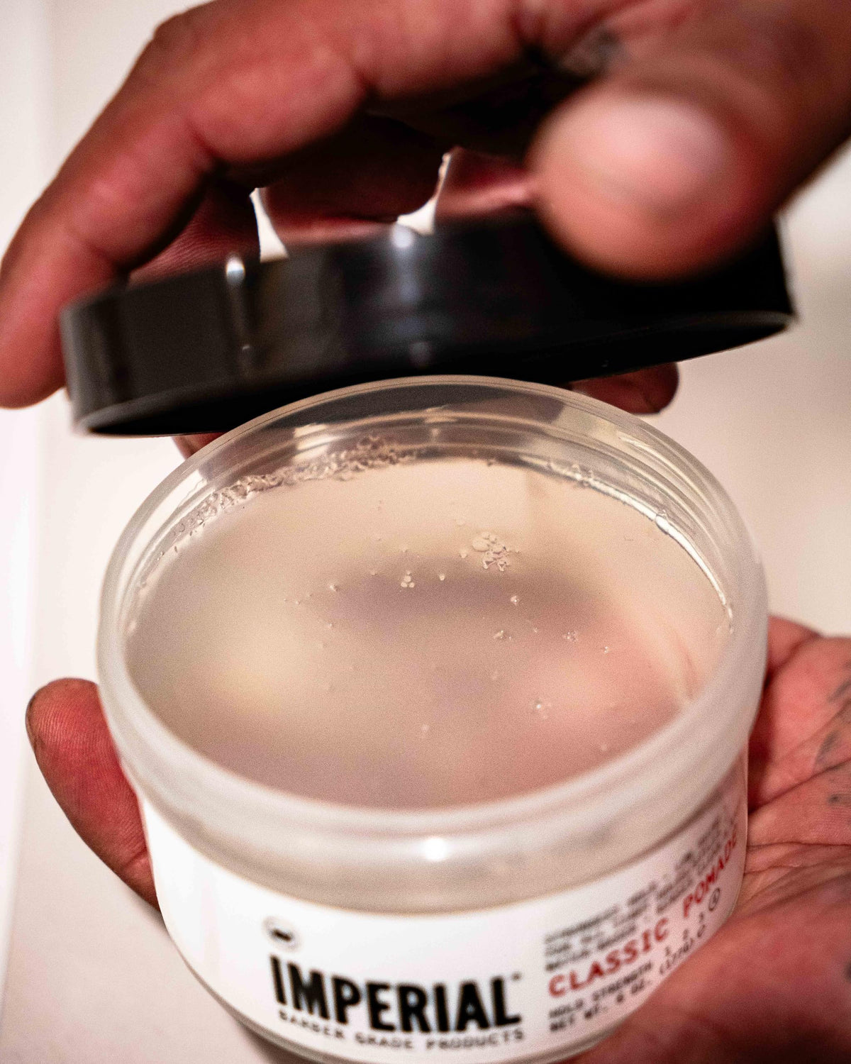 Imperial Barber Grade Products on hands demonstrating smooth spread and easy control