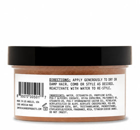 Imperial Barber Grade Products open jar with visible fibers, texture detail for styling control