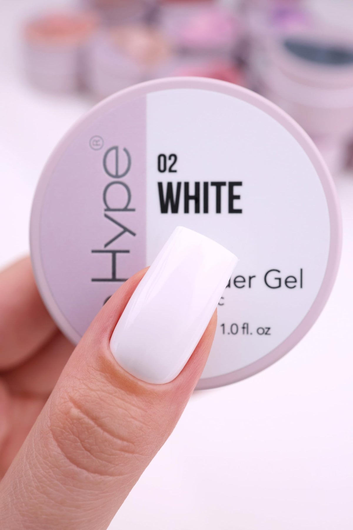 IN.HYPE brush spreading gel close-up, shows smooth consistency and control benefit