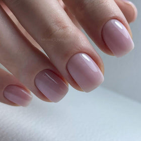 IN.HYPE manicured hands in natural light showing finished nails with smooth base and improved appearance