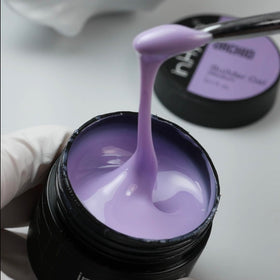 IN.HYPE finished manicure on hands displaying vibrant Purple Orchid color payoff